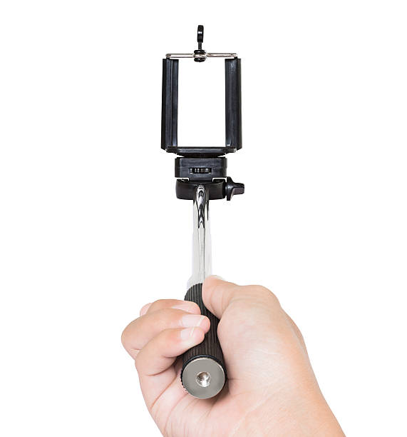 istock hand holding selfie stick isolated white 539347489