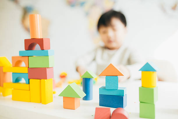 istock Toddler with wooden blocks 539350578