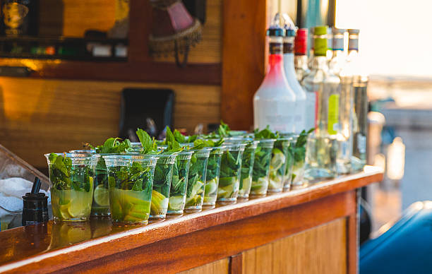 Alcoholic Beverages Lined Up on a Bar