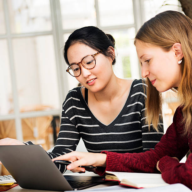 istock Women Friendship Studying Brainstorming Technology Concept 539352272