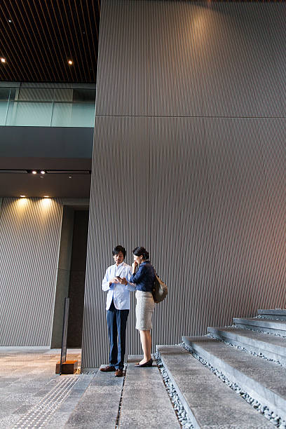 istock the business people talking at office lobby 539353324