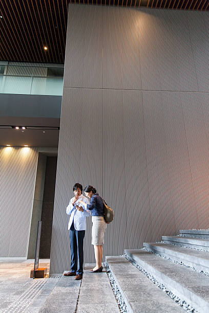 istock the business people talking at office lobby 539353358