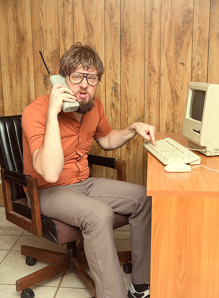 istock angry cell phone 1980s office man 539354660