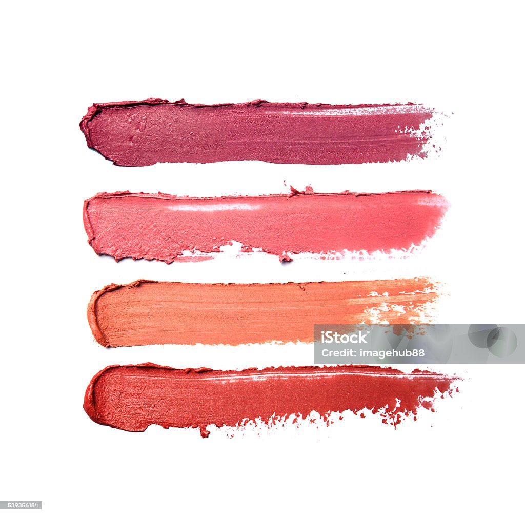 Collection of smudged lipsticks Collection of smudged lipsticks isolated on white Lipstick Stock Photo