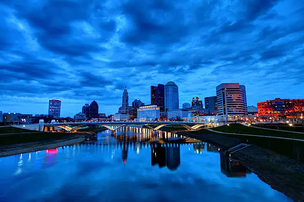 Columbus downtown skyline along the banks of the Scioto River. Columbus is the capital and largest city of the U.S. state of Ohio. It is the 15th largest city in the United States. Columbus has one of the fast growing economies and is known for its thriving arts scene and home to the state's largest academic institution 
