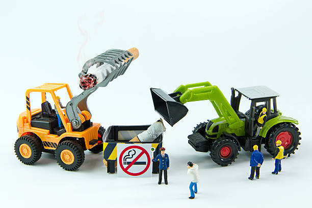 istock Tiny toys destroy cigarette.Concept No Smoking Day. 539358976