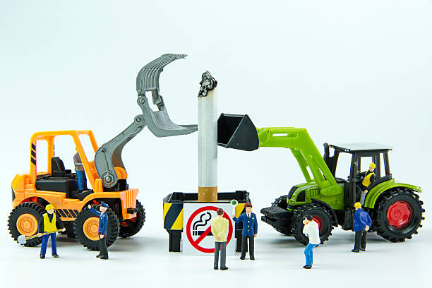 istock Tiny toys destroy cigarette.Concept No Smoking Day. 539359100