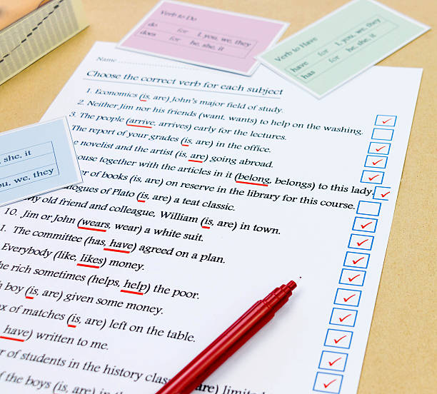 check mark box next to english exercise blue check mark box next to english sentence on white exercise sheet misspelled stock pictures, royalty-free photos & images