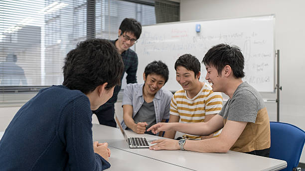 istock Five students smiling at a meeting room 539360080