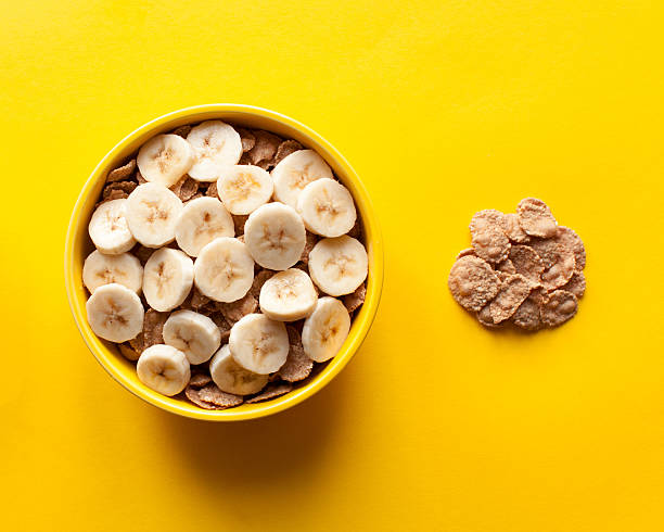 istock Muesli with fresh banana. Healthy diet breakfast top view 539360082