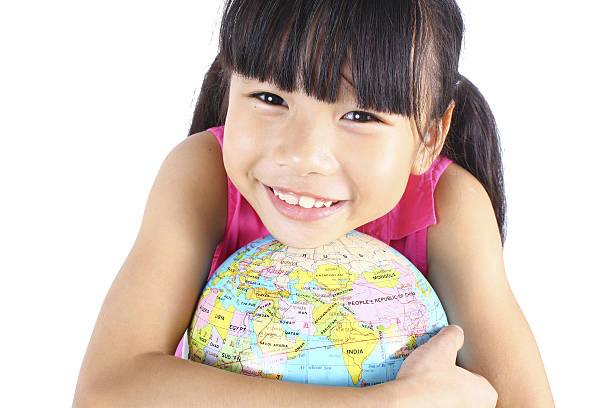 istock Young asian girl holding earth globe 539360496