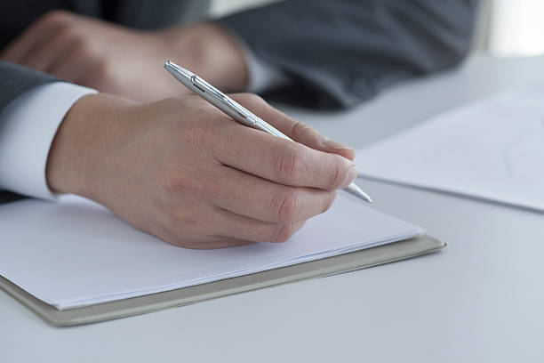 istock Businessman holding pen 539360590