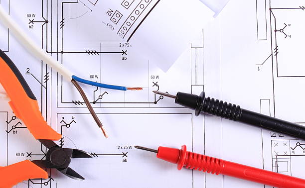 istock Cables of multimeter, pliers, electric wire and construction drawing 539361162