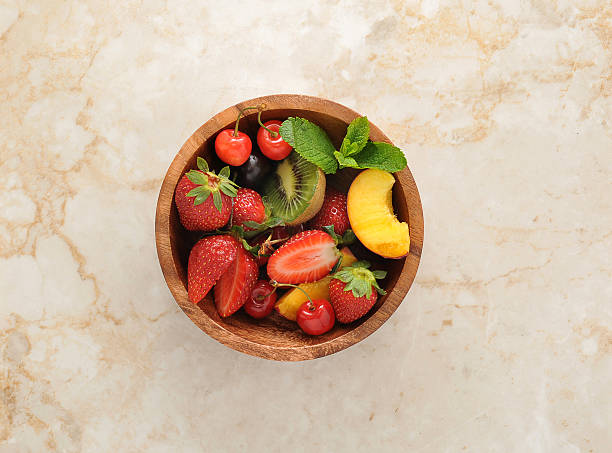 istock Berries in wooden plate 539361252