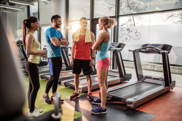 istock Team of young athletes communicating on break in a gym. 539362014