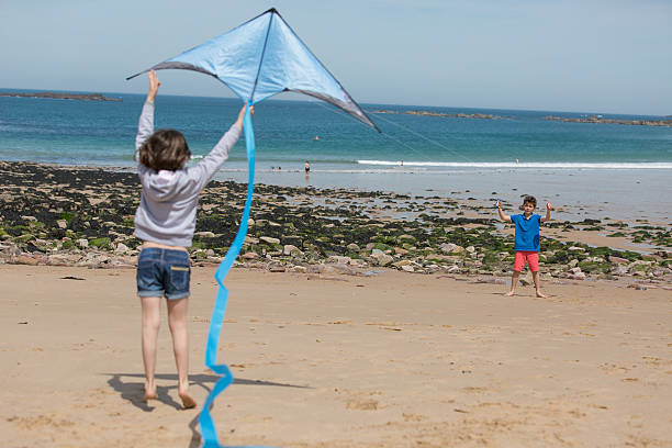 istock Family playing with kite 539366056