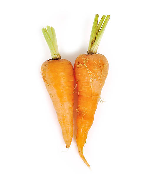 istock carrots close up isolated on white background 539366374