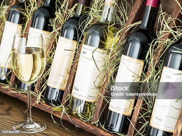 Wine Bottles On The Wooden Shelf Stock Photo - Download Image Now - Adulation, Alcohol - Drink, Bottle