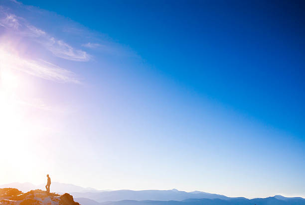 istock Silhouette of a climber on a mountain ridge. 539366600