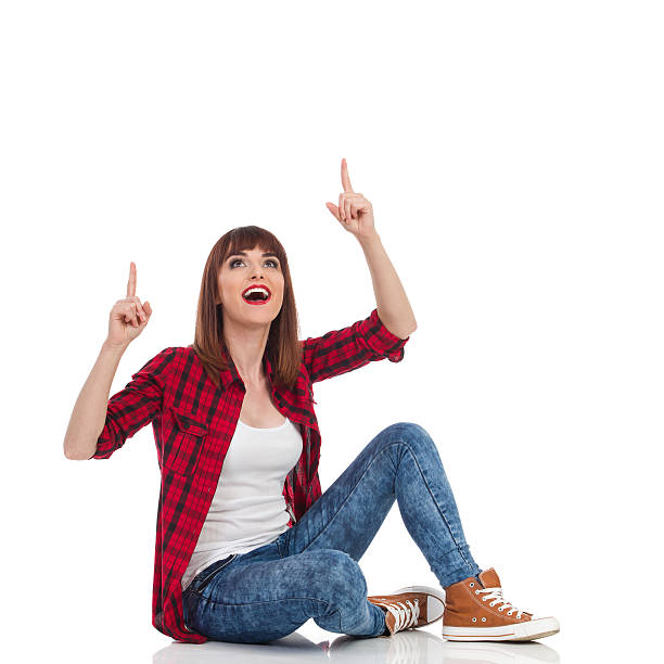 istock Excited Casual Woman Pointing Up 539369354