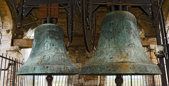 Aquileia, Italy - April 28, 2016: two  big bells at the tower of the basilica di Santa Maria Assunta