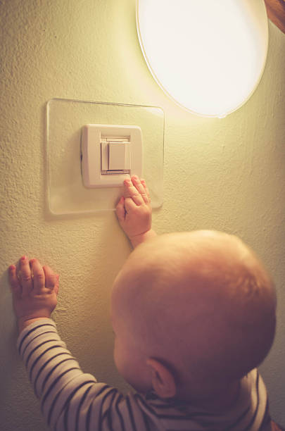 istock Baby child switching on / off the light 539369936