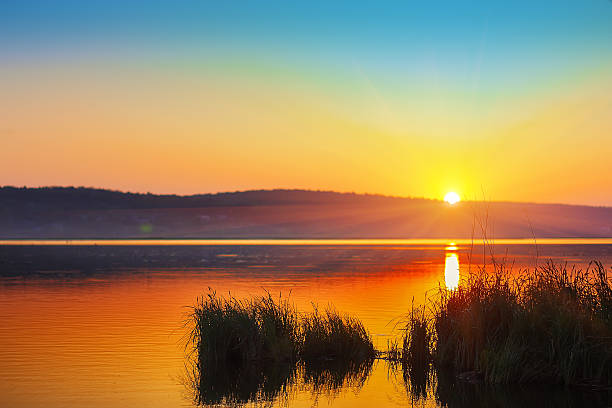 istock Beautiful sunset over calm lake. Dusk time 539370748