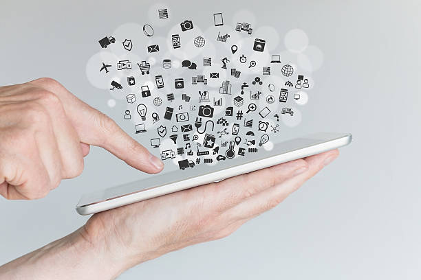 istock Internet of things (IoT) concept with hands holding tablet 539371976