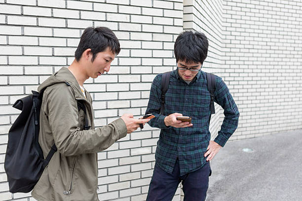 istock Young japanese students checking internet on smartphone  in kyoto japan 539372004