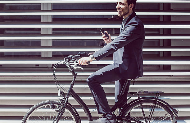 istock Businessman with bicycle on the phone 539372928