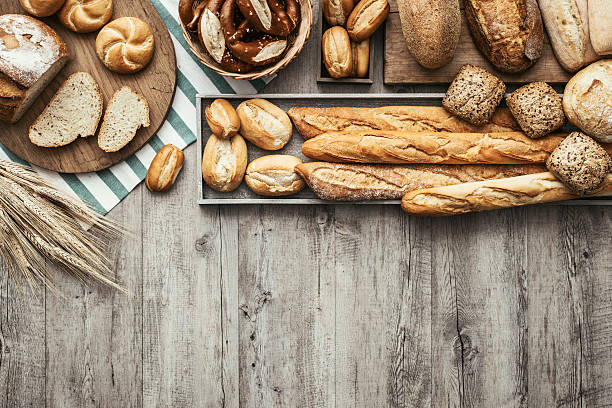 Fresh tasty bread Freshly baked delicious bread on a rustic wooden worktop with copy space, healthy eating concept, flat lay bakery photos stock pictures, royalty-free photos & images