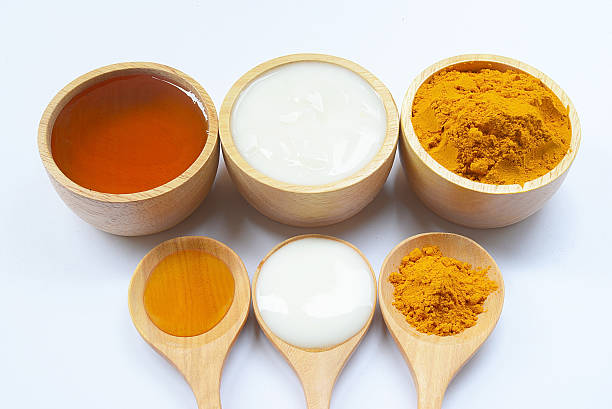 Yogurt, honey, turmeric powder to spa treatments. stock photo