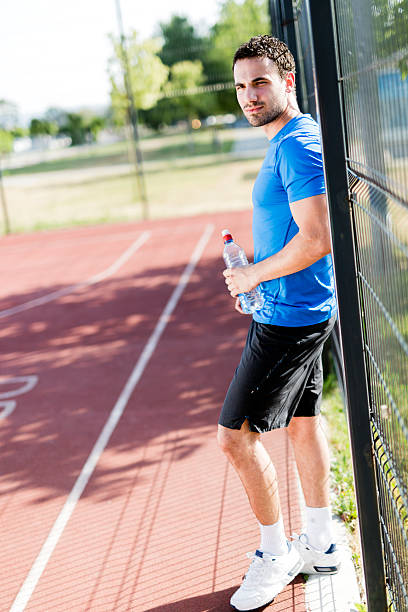 istock Young athlete taking a break on a hot summer day 539436770