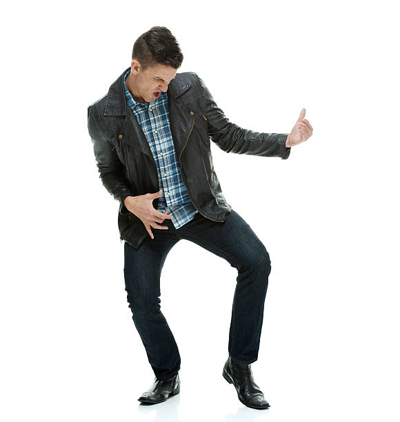 istock Excited man playing air guitar 539437640
