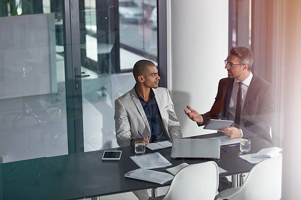 istock Bouncing off ideas in the boardroom 539440634