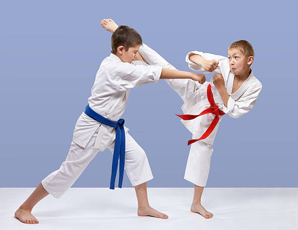 istock On a gray background athletes are training blows karate 539441188