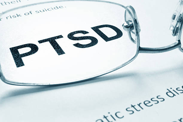 istock PTSD sign on a paper and glasses. 539442216