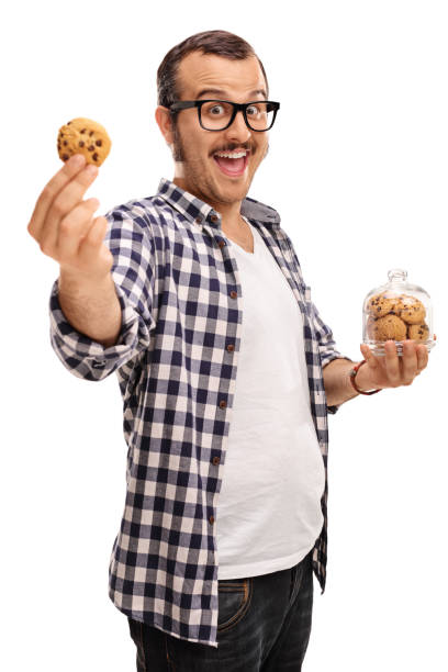 istock Joyful guy holding a jar of cookies 539442468
