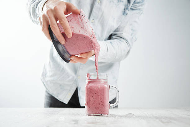 istock Preparation of healthy fruit berry smoothie process 539442704