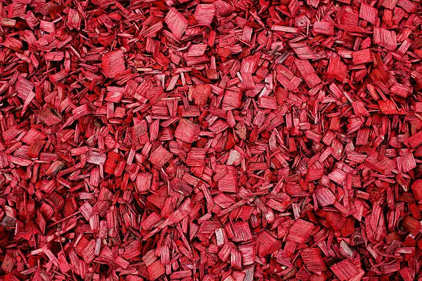 red garden mulch background. texture