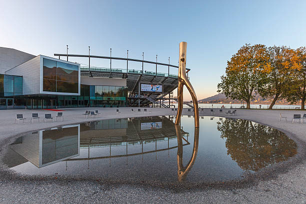 Bregenz, Opera House - Austria Bregenz, Austria - September 27, 2014: Gold sculpture reflected in the water in front of the Opera house, an open-air lakeside stage where people can attend the annual traditional Bregenzer Festspiele, with operas performed in spectacular fashion. bregenz stock pictures, royalty-free photos & images