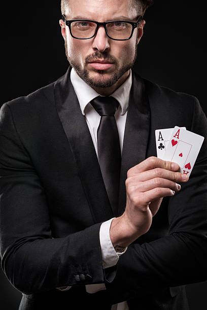 istock Man holding pair of aces 539445042