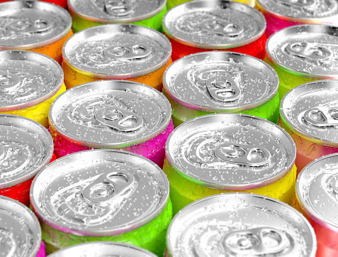 Colorful aluminum cans with water drops.