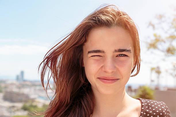 outdoor portrait of a teenage girl outdoor portrait of a teenage girl squint eyes stock pictures, royalty-free photos & images