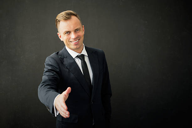 istock Happy business man with extended hand 539452702