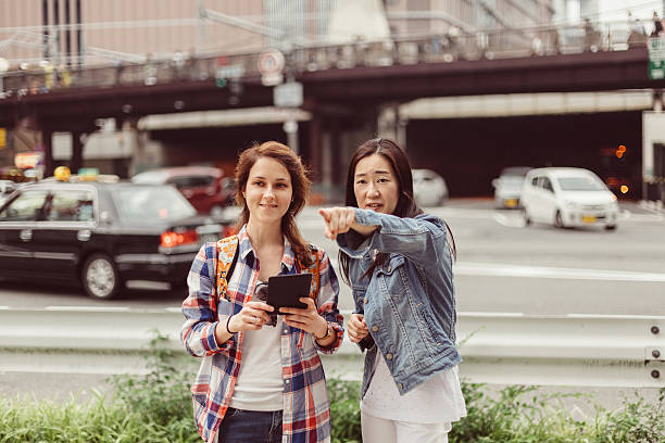Tourist in Japan asking local people for navigation