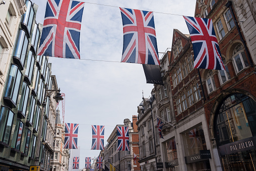 London, UK - June 16, 2016 : Union Jack Flag bunting in New Bond Street, London, to mark the 90th birthday of Queen Elizabeth II.