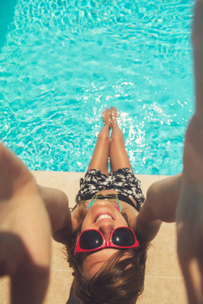 Beautiful woman having fun on the pool.