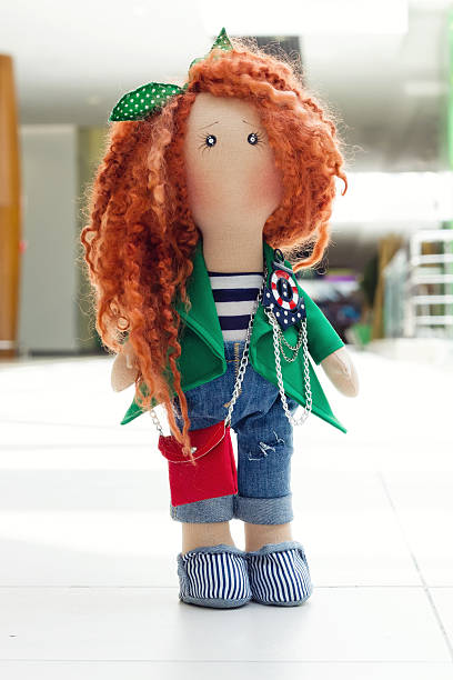 istock handmade doll with curly red hair 539457930