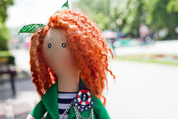 istock handmade doll with curly red hair 539457998